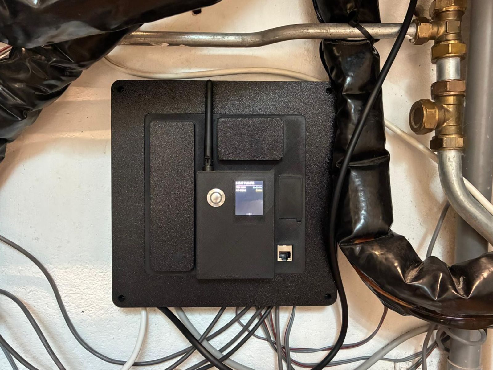 Custom wall-mounted VirtuHot controller with display and antenna